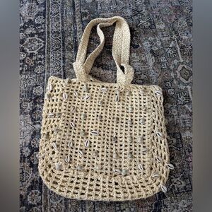 Cream crochet beach bag with shell details